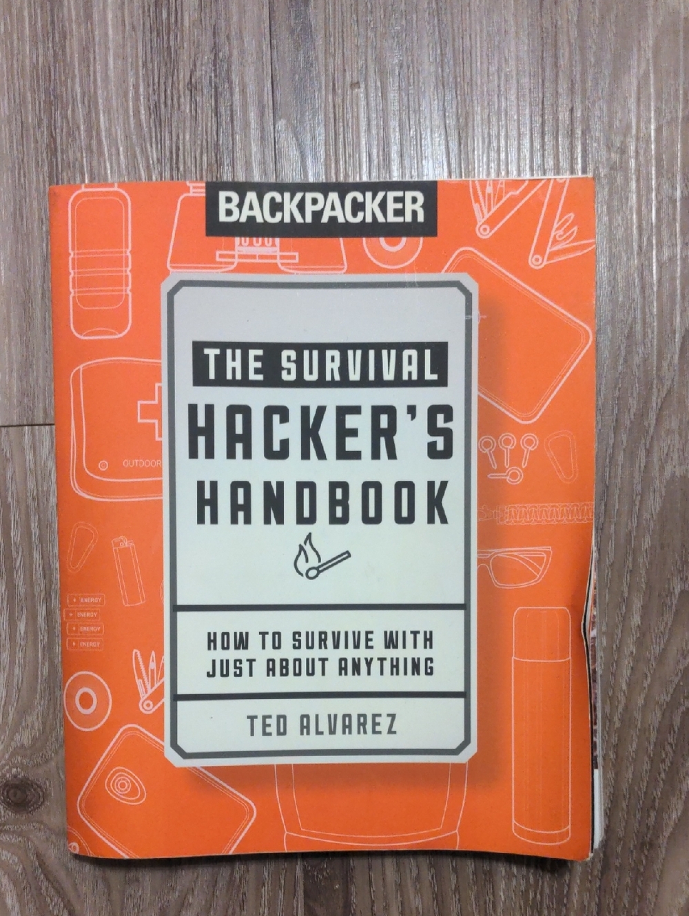 Backpacker The Survival Hacker's Handbook by Ted Alvarez - Orange Cover